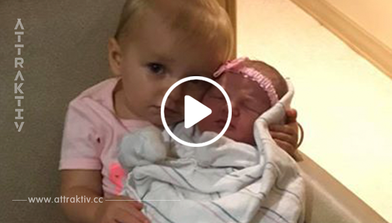 Dieses Mädchen schützt ihre neugeborene Schwester, und ihr böses Gesicht sieht so süß dabei (Video)